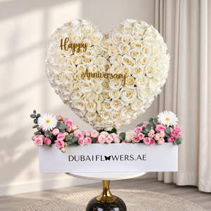 Anniversary White Heart with white roses, pink Bombastic roses, white gerbera and eucalyptus