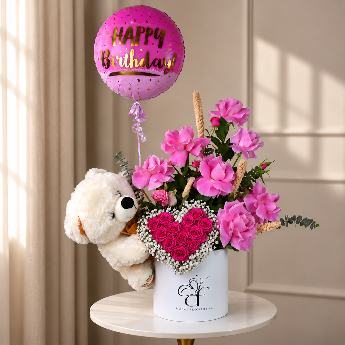 Birthday Pink Aura pink roses arrangement with dark pink rose heart, teddy bear and birthday balloon in Dubai